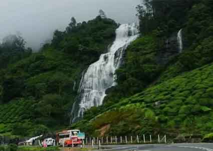 Couple enjoying romantic view of Chinnakanal Waterfalls