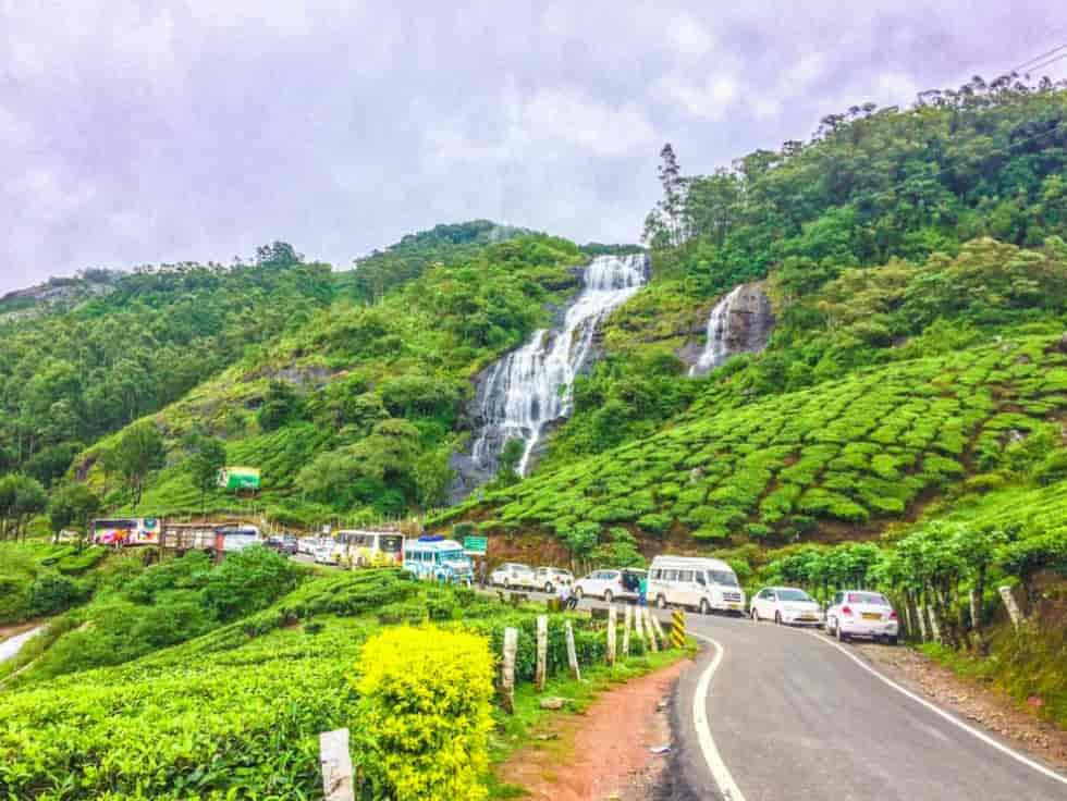 Tourists enjoying Chinnakanal Waterfalls view