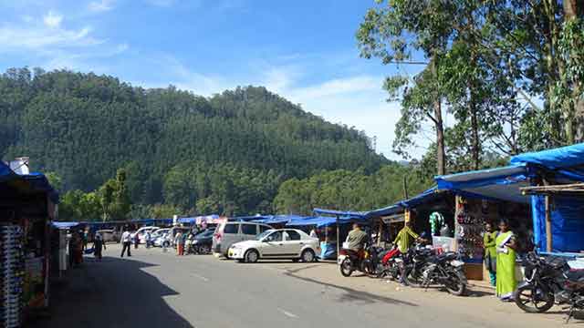 Families and tourists visiting Echo Point picnic spot in Munnar