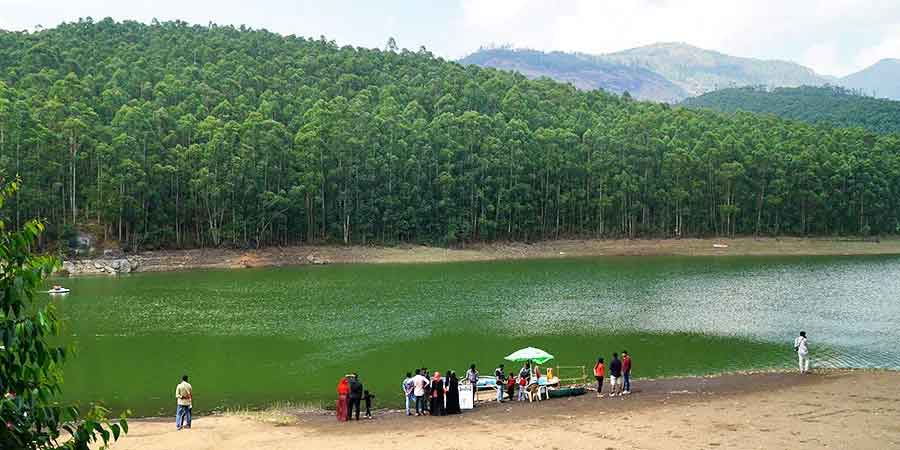 Tourists enjoying the echo phenomenon at Echo Point Munnar