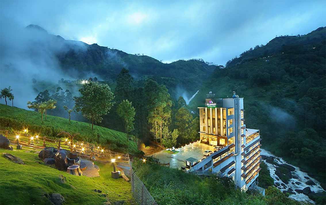 Munnar resort with swimming pool and tea garden view