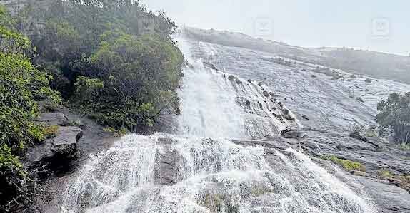 Tourists Visiting Irachi Para Waterfalls Munnar