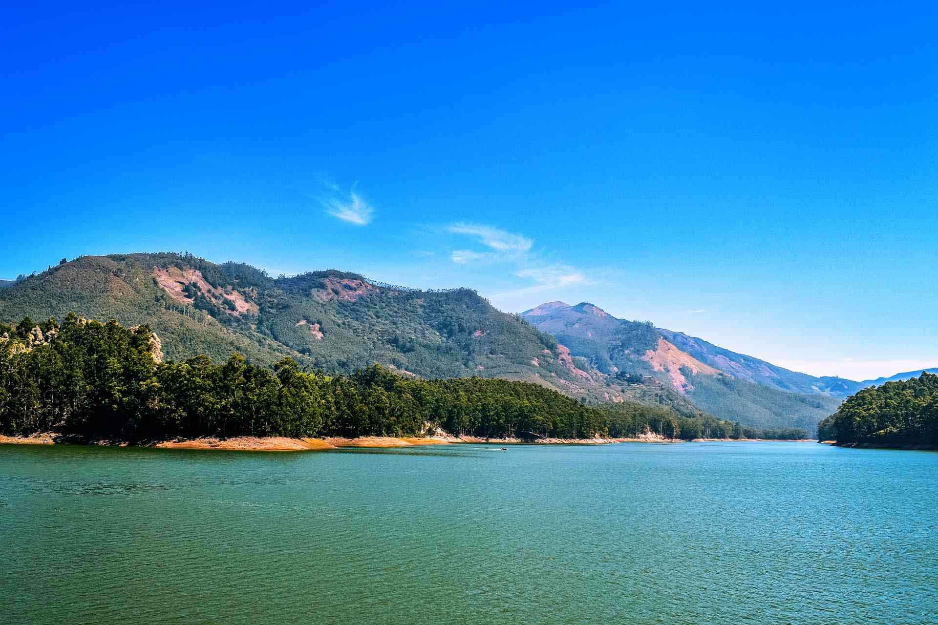 Mattupetty Dam Munnar lake with boating and hills