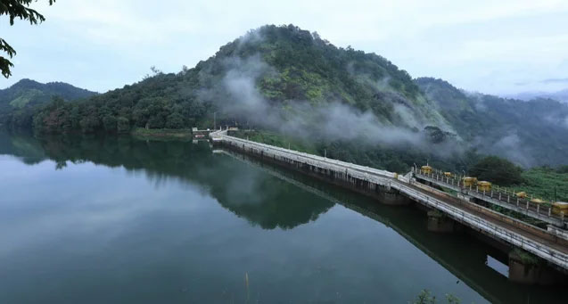 Green hills and calm waters at Ponmudi Dam Kerala tourism spot