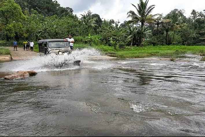 Young travellers enjoying river crossing in Munnar Kerala