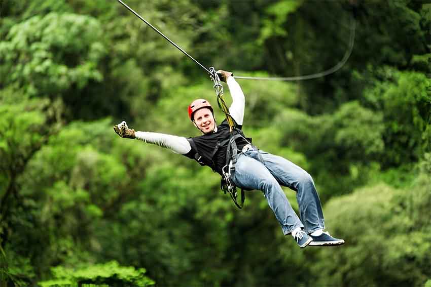 Couples enjoying zipline adventure in Munnar