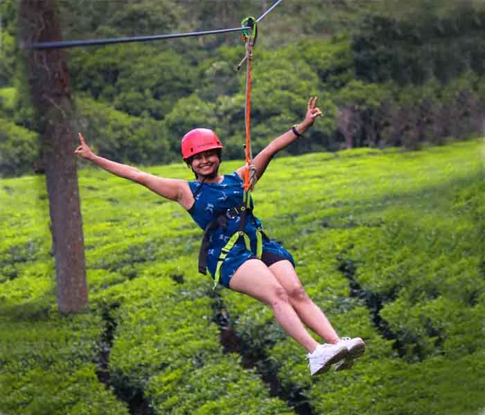 Family enjoying zipline activity in Munnar